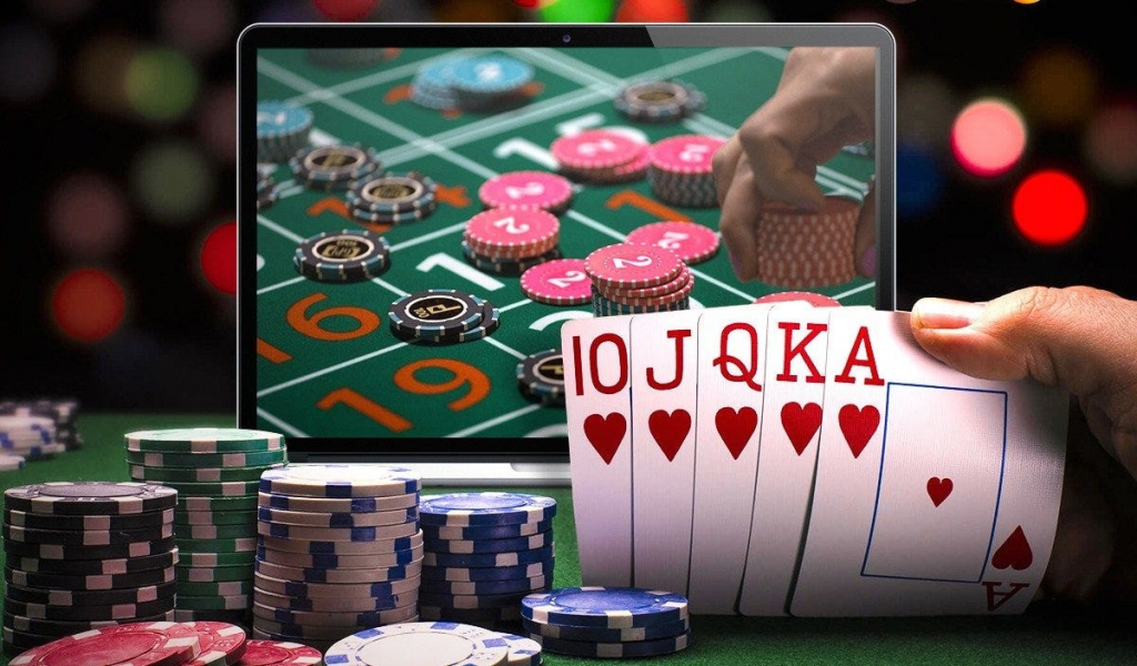 cards and chips, laptop with casino table